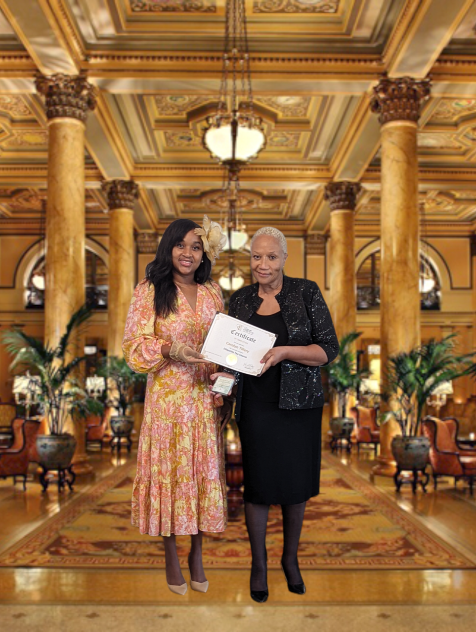 A woman and an older lady holding a certificate.