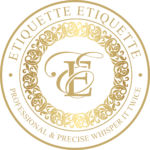 A gold seal with the word " etiquette " in it.