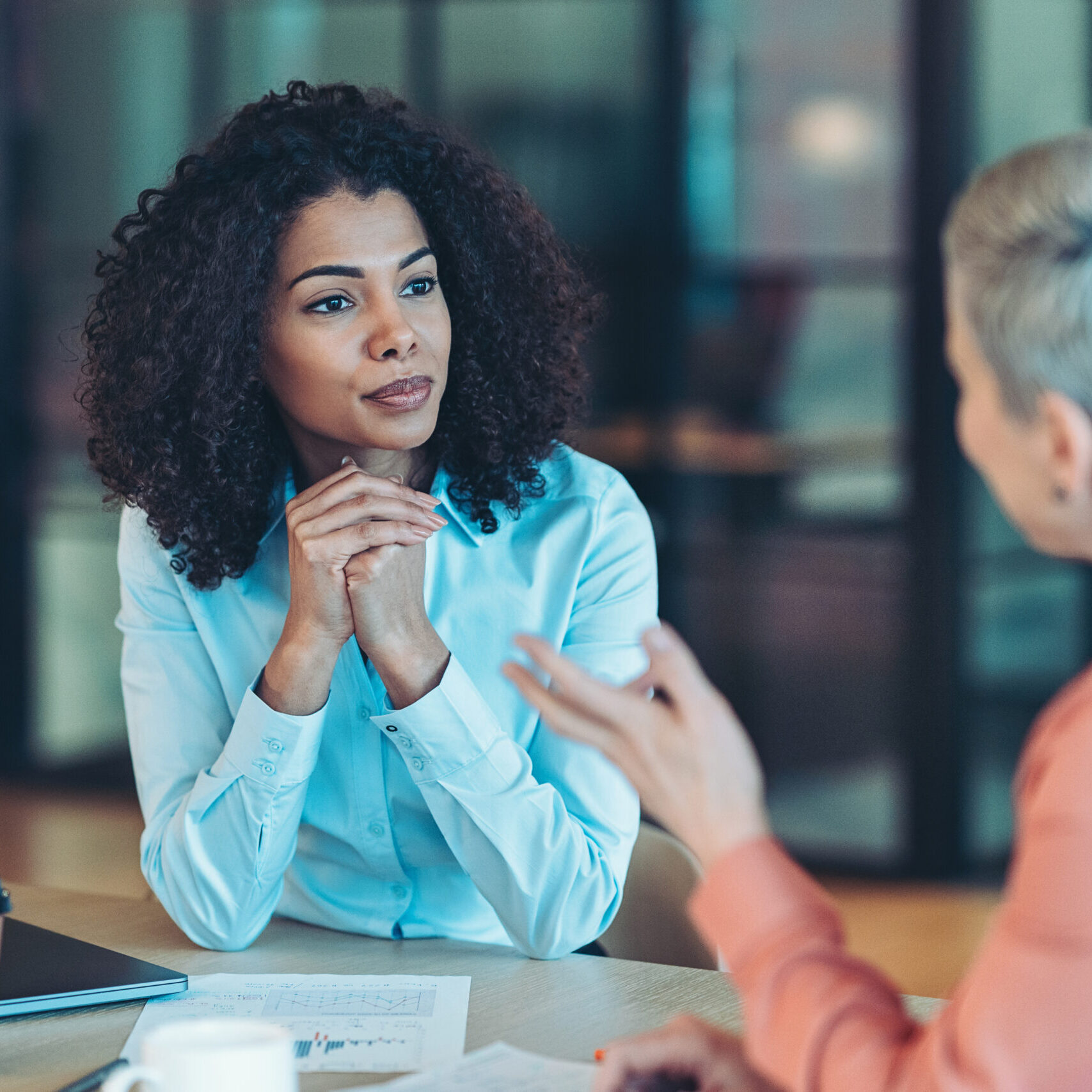 Two businesswomen talking in the office