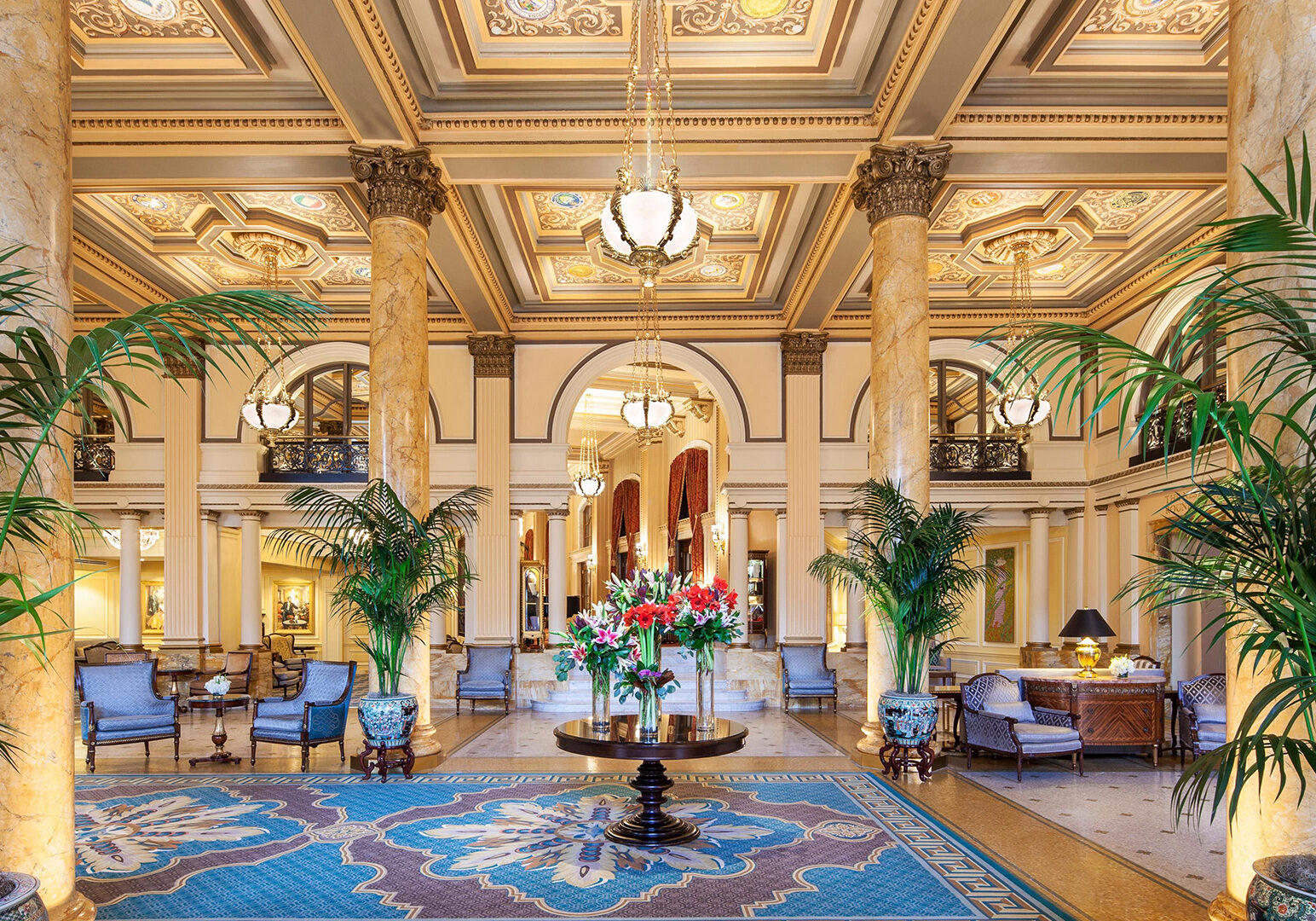 A lobby with many chairs and tables in it